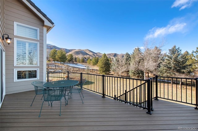 wooden deck featuring a mountain view