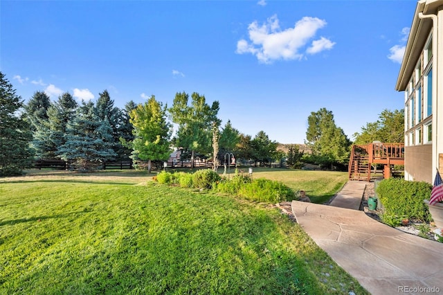 view of yard with a deck