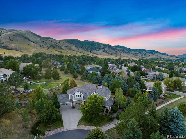 aerial view at dusk with a mountain view