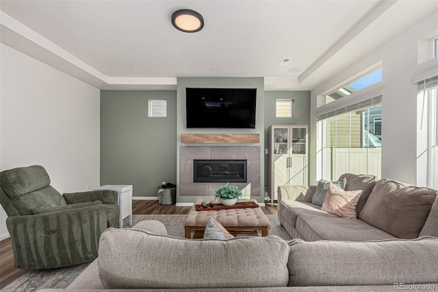 4104 N Picadilly Ct, Aurora, CO 80019 - living area featuring wood finished floors and a fireplace