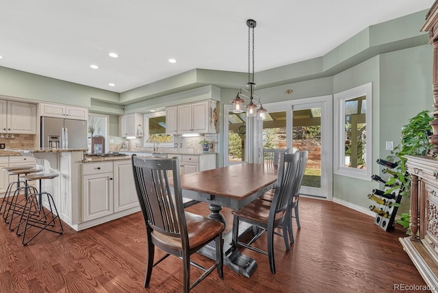 dining area featuring baseboards, dark wood-type flooring, and recessed lighting