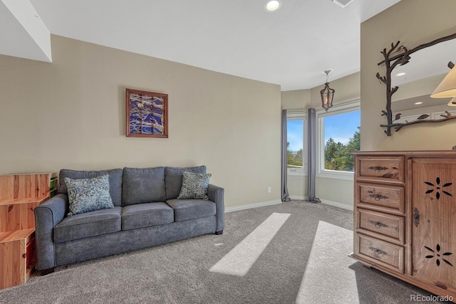 carpeted living room with recessed lighting and baseboards