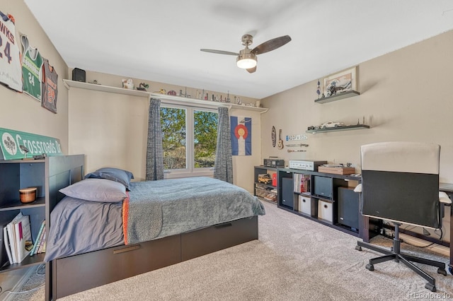 bedroom with a ceiling fan and carpet