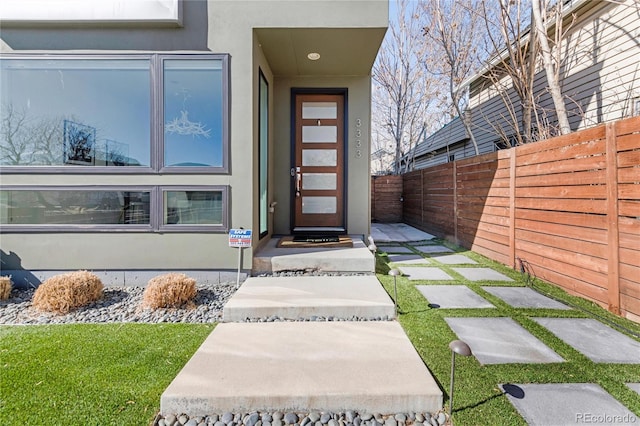 3333 Osage St, Denver, CO 80211 - view of exterior entry featuring fence and stucco siding
