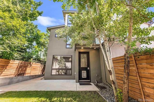 3333 Osage St, Denver, CO 80211 - view of front facade featuring stucco siding and a patio