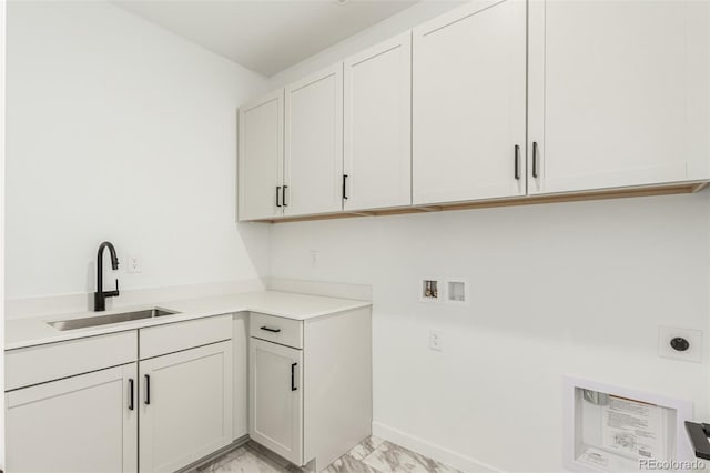 1826 Hickory Ave, Erie, CO 80516 - laundry area featuring hookup for an electric dryer, light marble finish flooring, cabinet space, and hookup for a washing machine