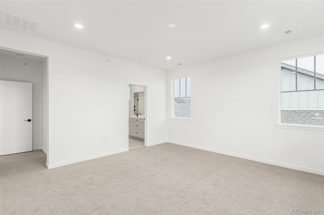 1826 Hickory Ave, Erie, CO 80516 - unfurnished room with light carpet, recessed lighting, and plenty of natural light