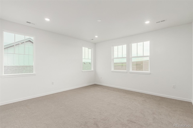 1826 Hickory Ave, Erie, CO 80516 - spare room with light carpet and recessed lighting