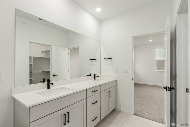 1826 Hickory Ave, Erie, CO 80516 - bathroom featuring double vanity and recessed lighting