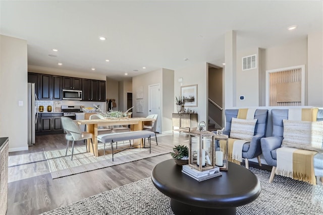 living room with light hardwood / wood-style floors