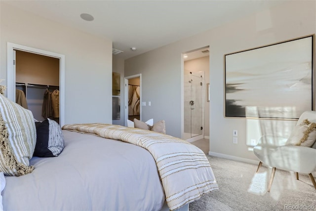 bedroom featuring carpet floors, a spacious closet, connected bathroom, and a closet