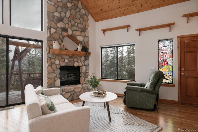 507 Gcr 4980, Grand Lake, CO 80447 - living area featuring hardwood / wood-style flooring, a fireplace, baseboards, and high vaulted ceiling