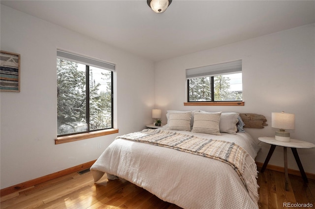 507 Gcr 4980, Grand Lake, CO 80447 - bedroom with baseboards, multiple windows, and wood finished floors