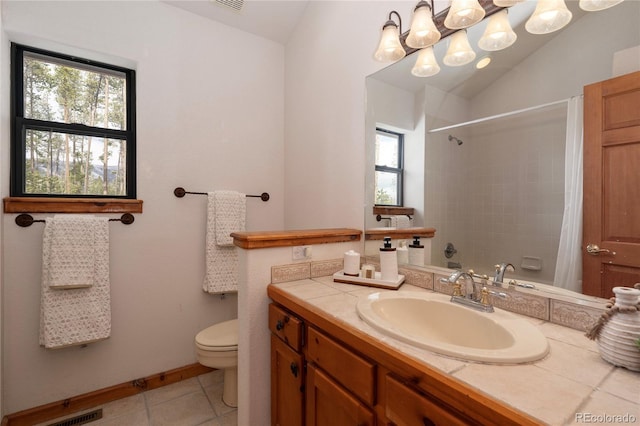 507 Gcr 4980, Grand Lake, CO 80447 - bathroom featuring healthy amount of natural light, toilet, a shower with shower curtain, vanity, and lofted ceiling