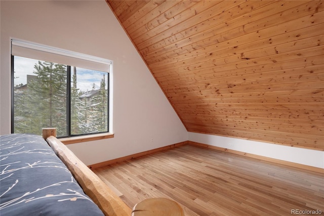 507 Gcr 4980, Grand Lake, CO 80447 - bedroom featuring vaulted ceiling, wooden ceiling, baseboards, and light wood-type flooring