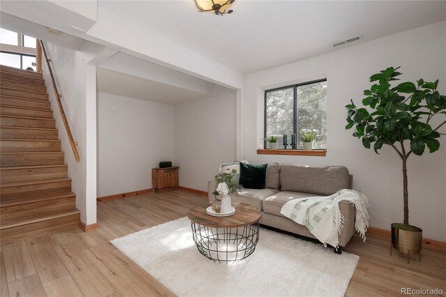 507 Gcr 4980, Grand Lake, CO 80447 - living room with stairway, light wood-type flooring, plenty of natural light, and baseboards