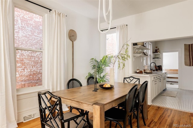 321 Fox St, Denver, CO 80223 - dining space with light wood-style flooring