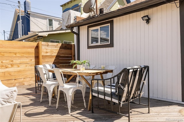 321 Fox St, Denver, CO 80223 - wooden terrace with outdoor dining space and fence