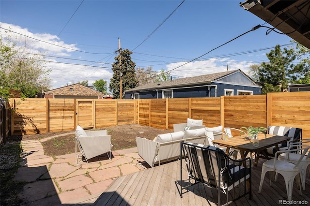 321 Fox St, Denver, CO 80223 - view of patio / terrace featuring outdoor dining space, a fenced backyard, and a wooden deck