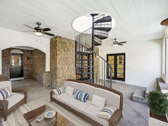 view of patio with ceiling fan, stairway, and an outdoor living space