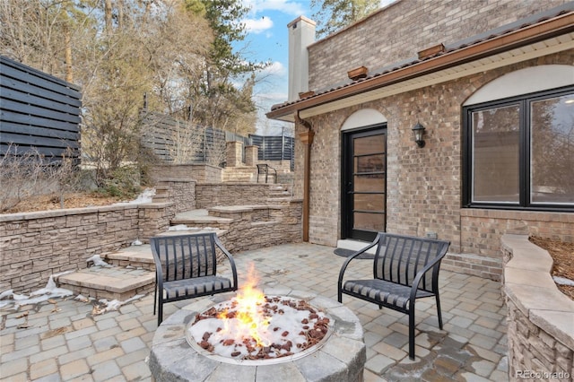 view of patio featuring a fire pit