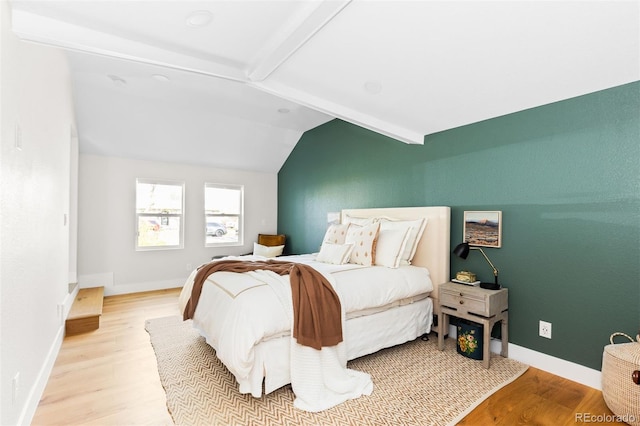 bedroom with wood finished floors and baseboards