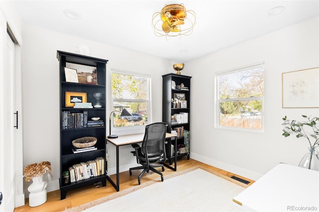 office with wood finished floors and baseboards