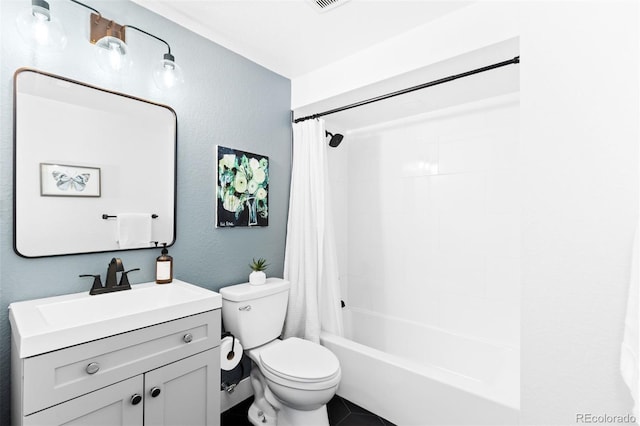 full bathroom with a textured wall, toilet, vanity, and shower / tub combo