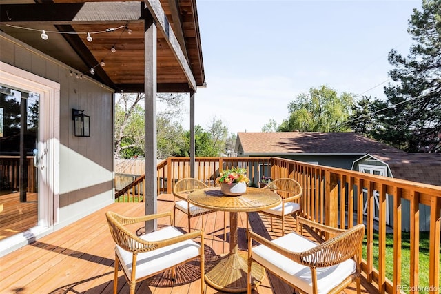 wooden deck featuring outdoor dining space