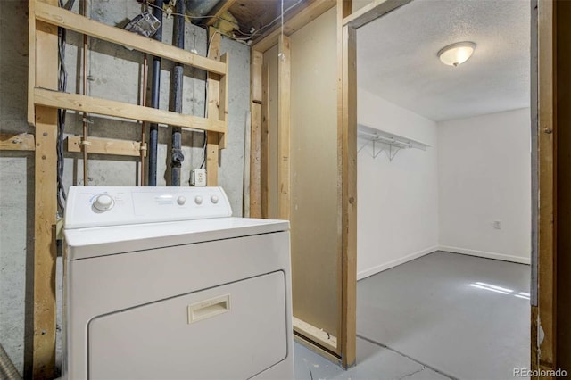 washroom featuring laundry area and washer / dryer