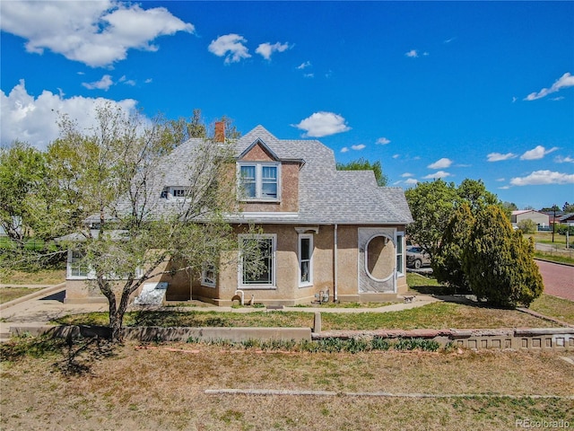 1601 San Pedro Ave, Trinidad, CO 81082 - view of front facade with a chimney and stucco siding