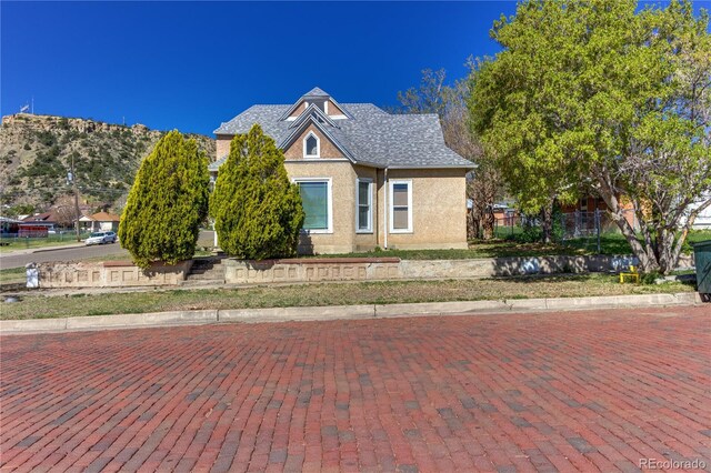 1601 San Pedro Ave, Trinidad, CO 81082 - view of front of property with stucco siding and a shingled roof