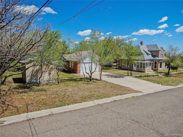 1601 San Pedro Ave, Trinidad, CO 81082 - view of front of house featuring an attached garage, a front yard, and driveway