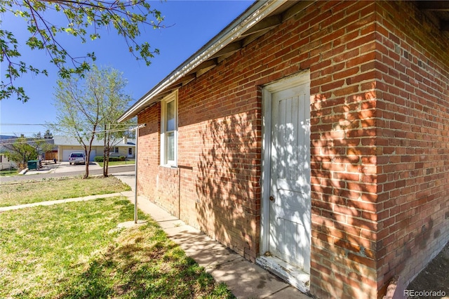 1601 San Pedro Ave, Trinidad, CO 81082 - view of home's exterior featuring a lawn and brick siding