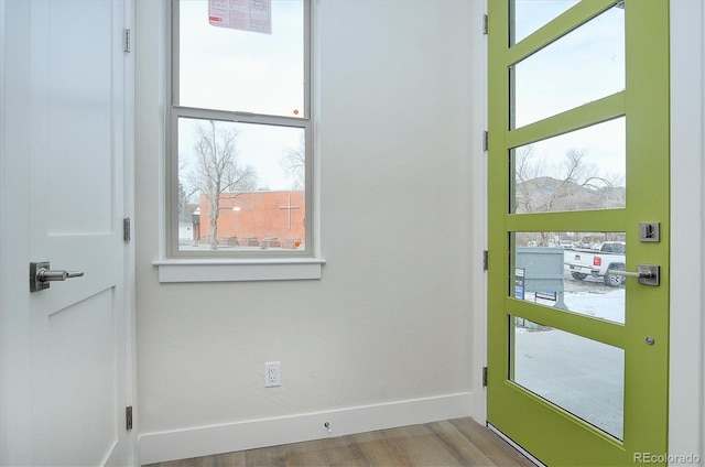 doorway to outside featuring hardwood / wood-style flooring