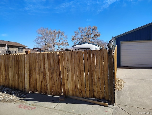 view of gate featuring fence