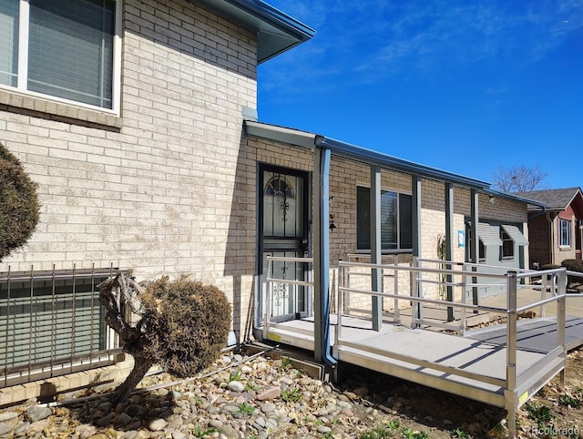 exterior space featuring brick siding