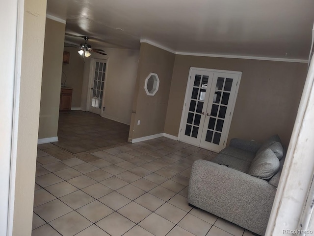 unfurnished living room with light tile patterned floors, french doors, baseboards, and crown molding