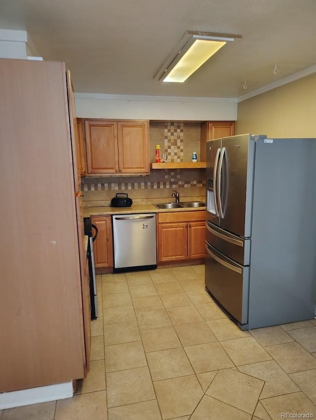 kitchen featuring brown cabinets, a sink, open shelves, stainless steel appliances, and decorative backsplash