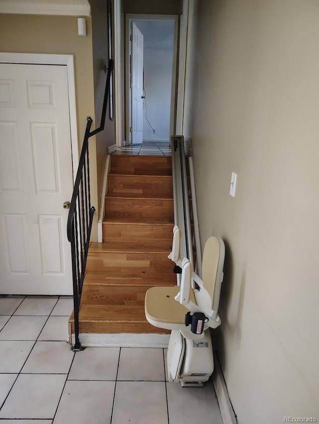 stairs with tile patterned flooring