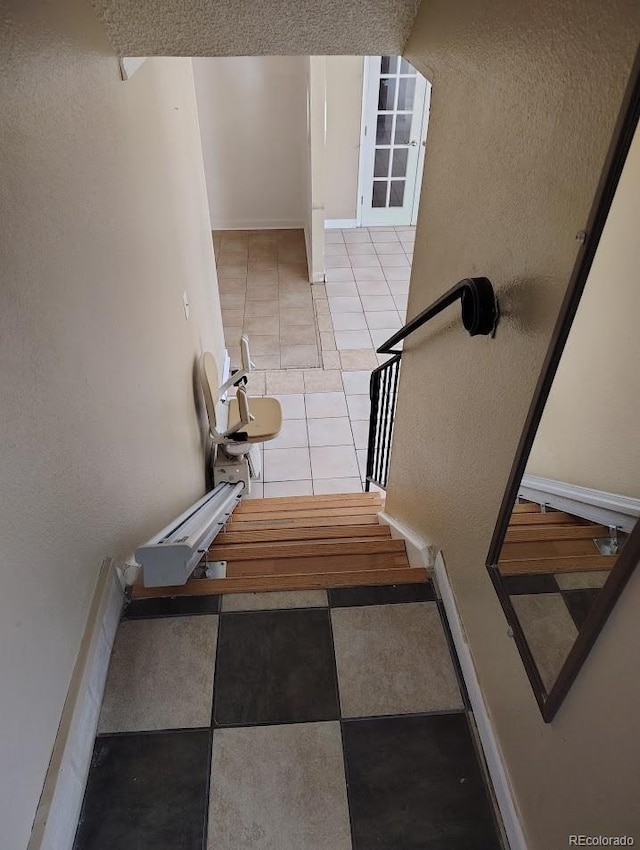 stairs featuring tile patterned floors