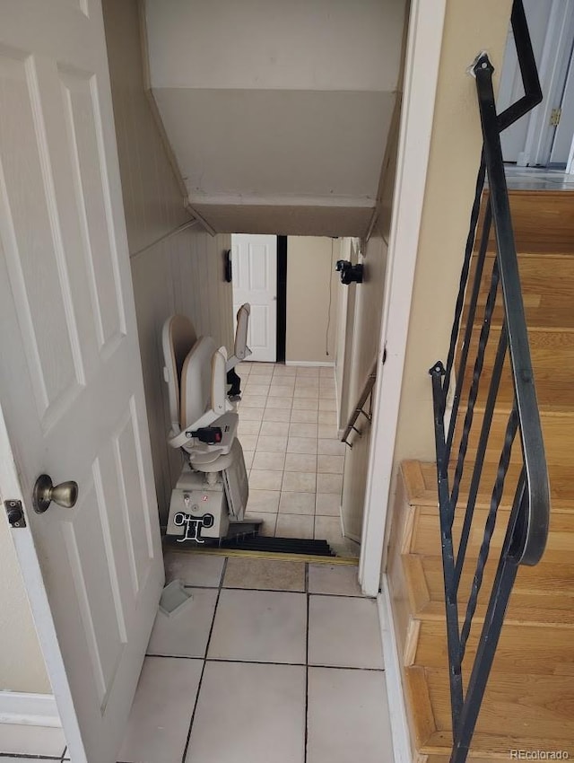 stairs with tile patterned flooring