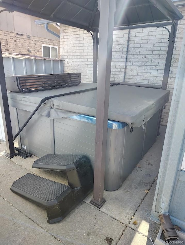 view of patio / terrace featuring a hot tub