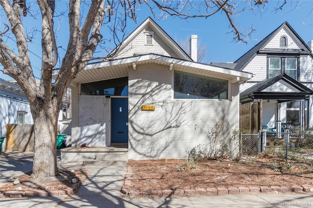 1723 E 16th Ave, Denver, CO 80218 - view of front of house featuring a chimney and brick siding