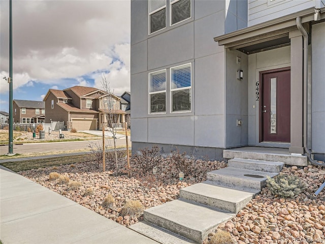 view of exterior entry featuring a garage