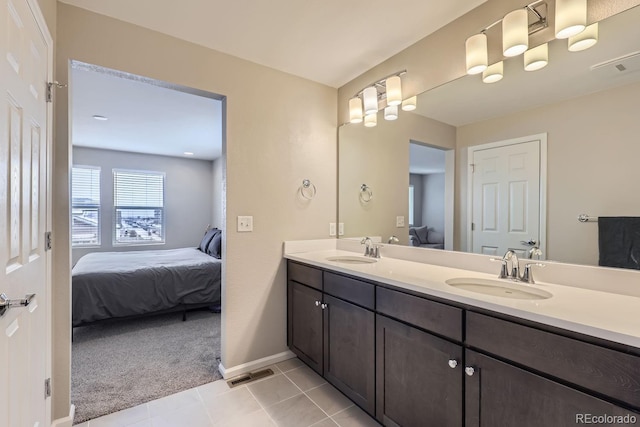 bathroom featuring tile patterned flooring and vanity