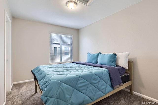 bedroom with baseboards and carpet flooring