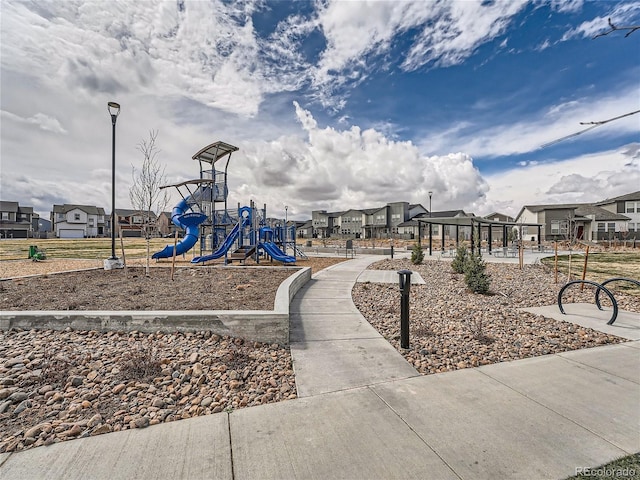 community jungle gym with a residential view