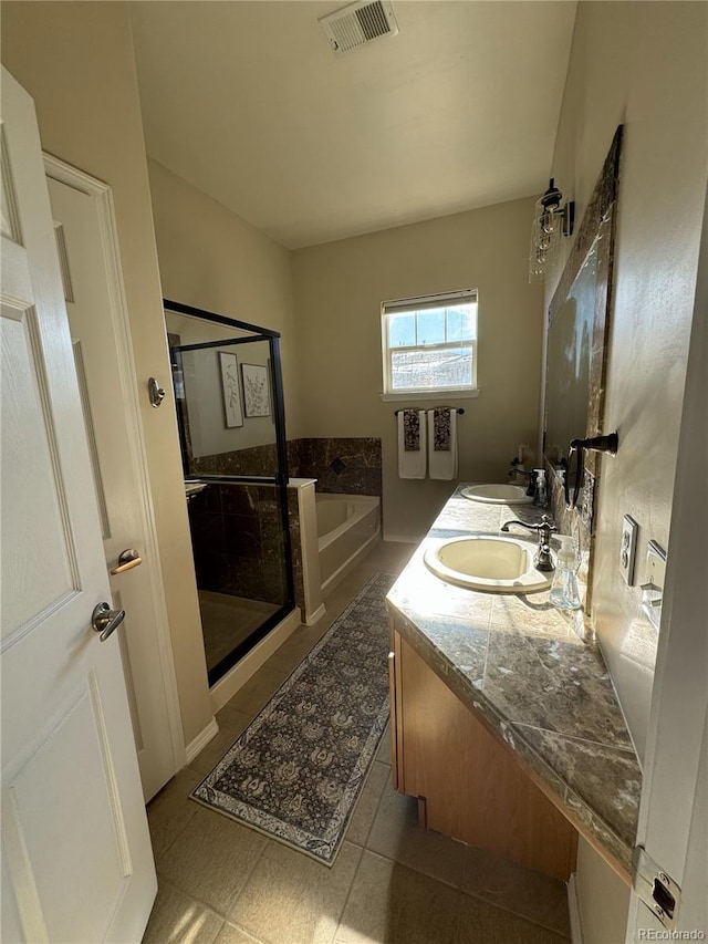 bathroom featuring tile patterned floors, vanity, and plus walk in shower