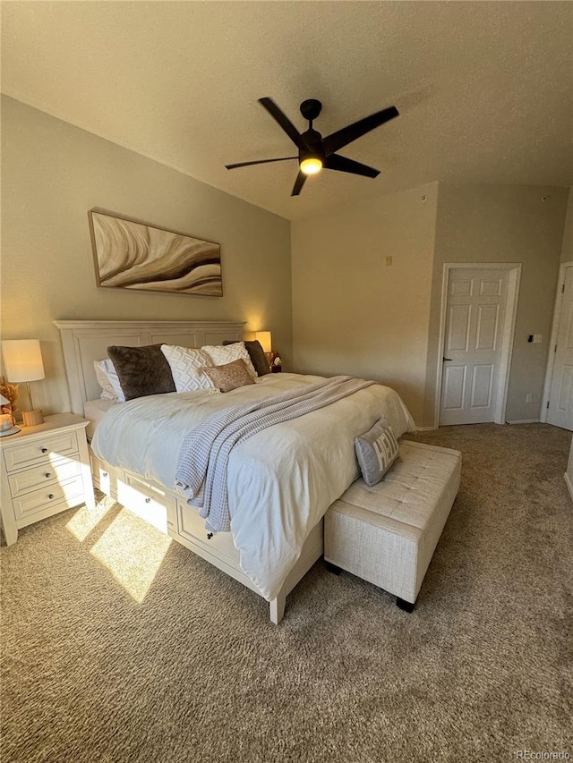 carpeted bedroom with a textured ceiling and ceiling fan